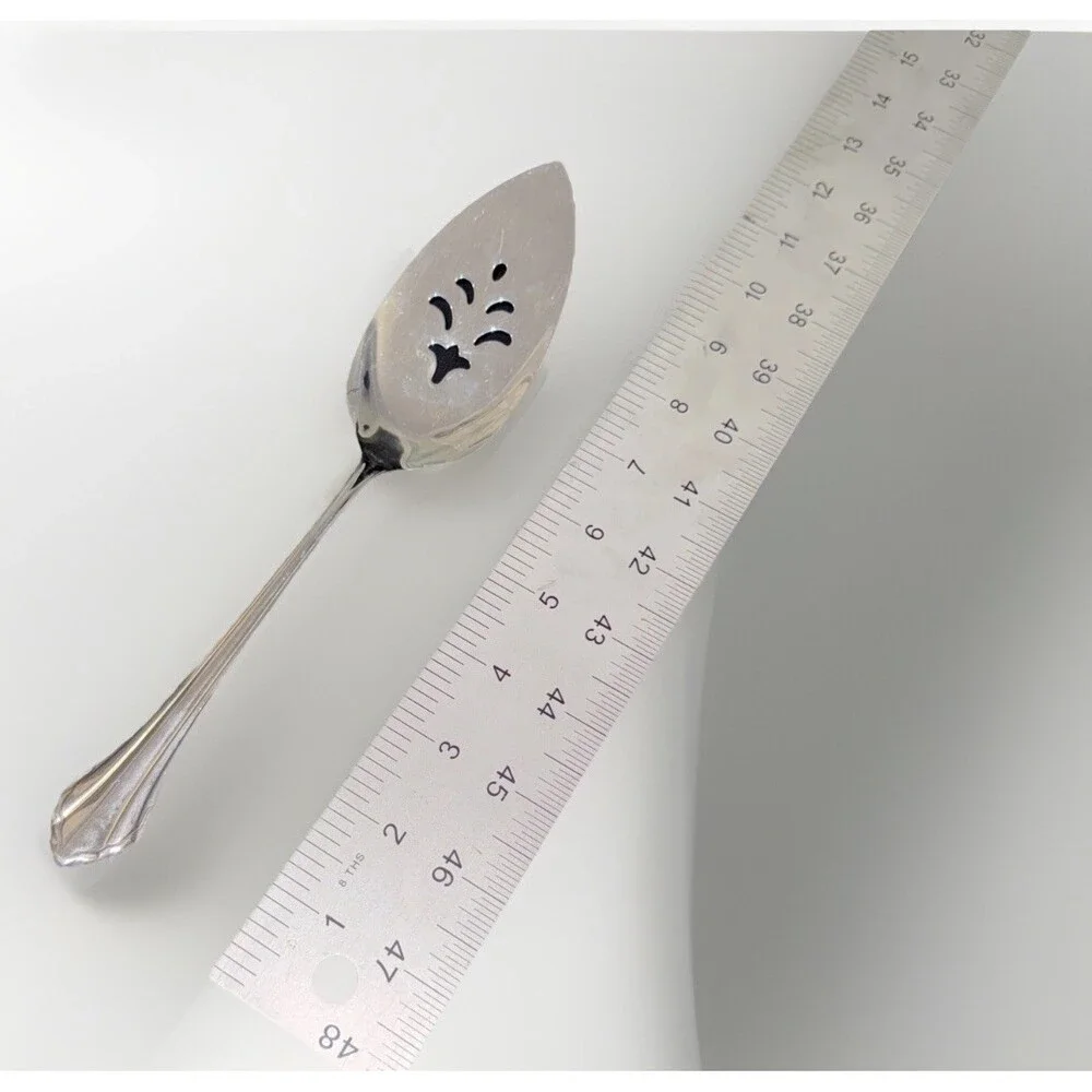 Oneida Community Royal Flute pierced pie server in stainless steel. 9.5”